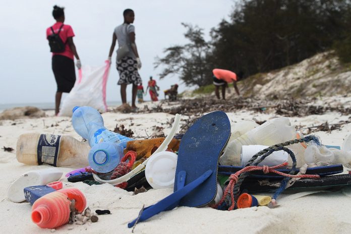 This Kenyan company turns flip flops left on the beach into works of art

