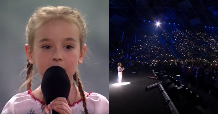  VIDEO.  After fleeing Kiev, a little girl sings the Ukrainian national anthem in front of 14,000 people


